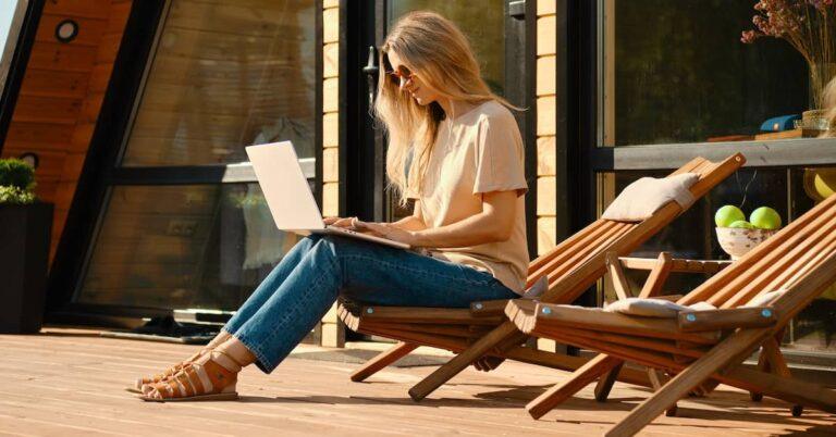 Woman looking at computer outside