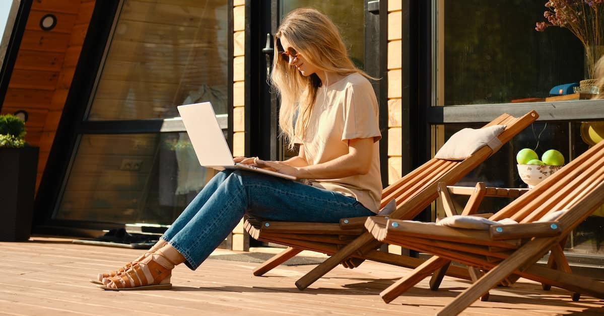 Woman looking at computer outside